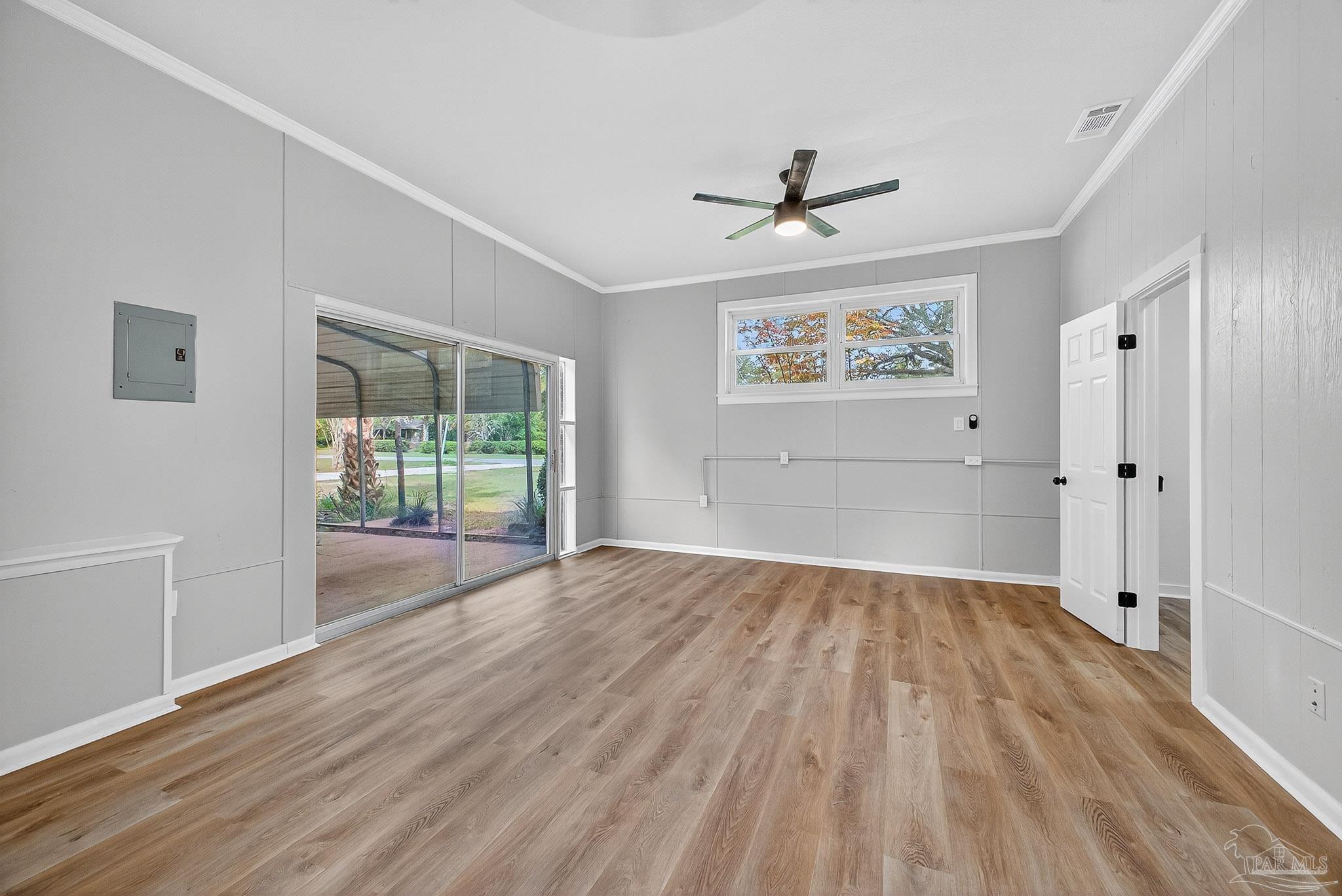 4673 Van Horn Road Milton, FL 32583 - Photo 47 of 53 an empty room with wooden floor and windows