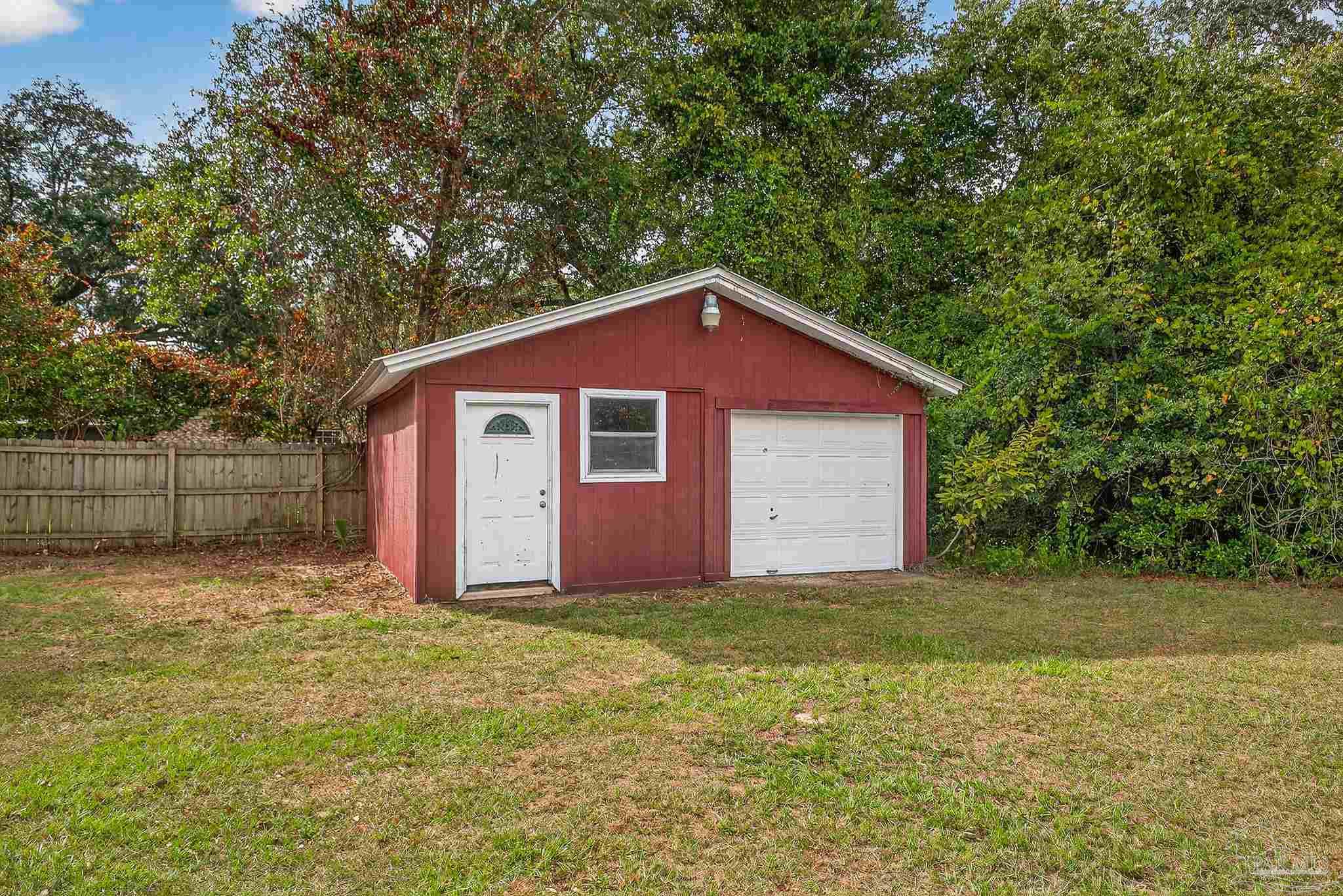 4673 Van Horn Road Milton, FL 32583 - Photo 48 of 53 a view of a house with a yard