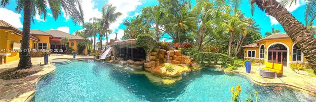 a view of swimming pool with a patio