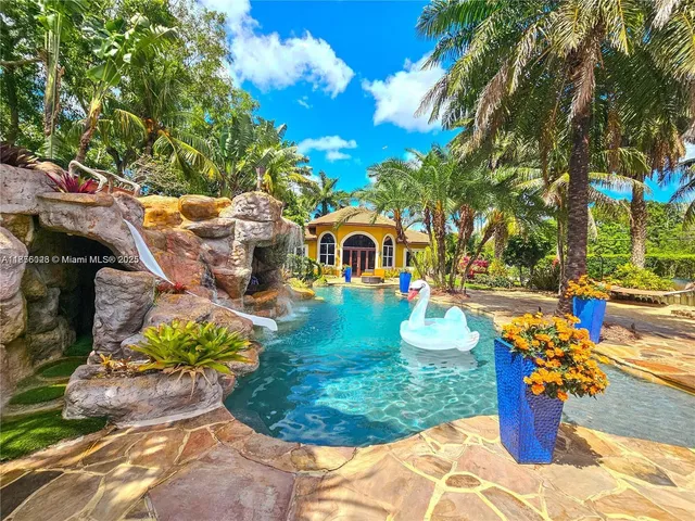 a lobby with furniture and a flat screen tv