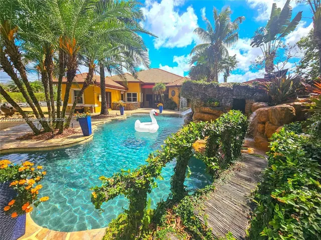 a large spacious bathroom with a large tub sink and mirror