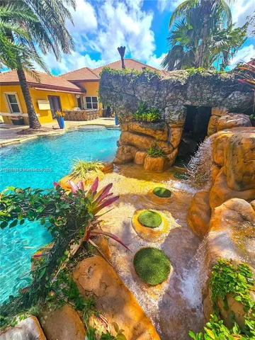 an aerial view of a backyard of a house