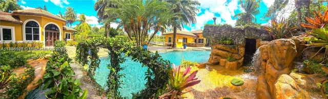 a view of a backyard with trampoline