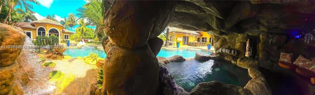 a view of a yard with a tree