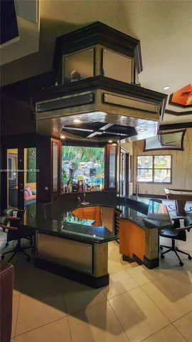 a room with lots of furniture and a rug