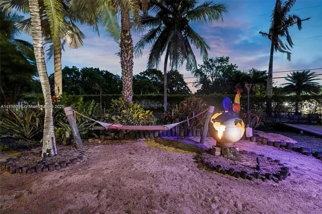 an aerial view of a residential houses with outdoor space