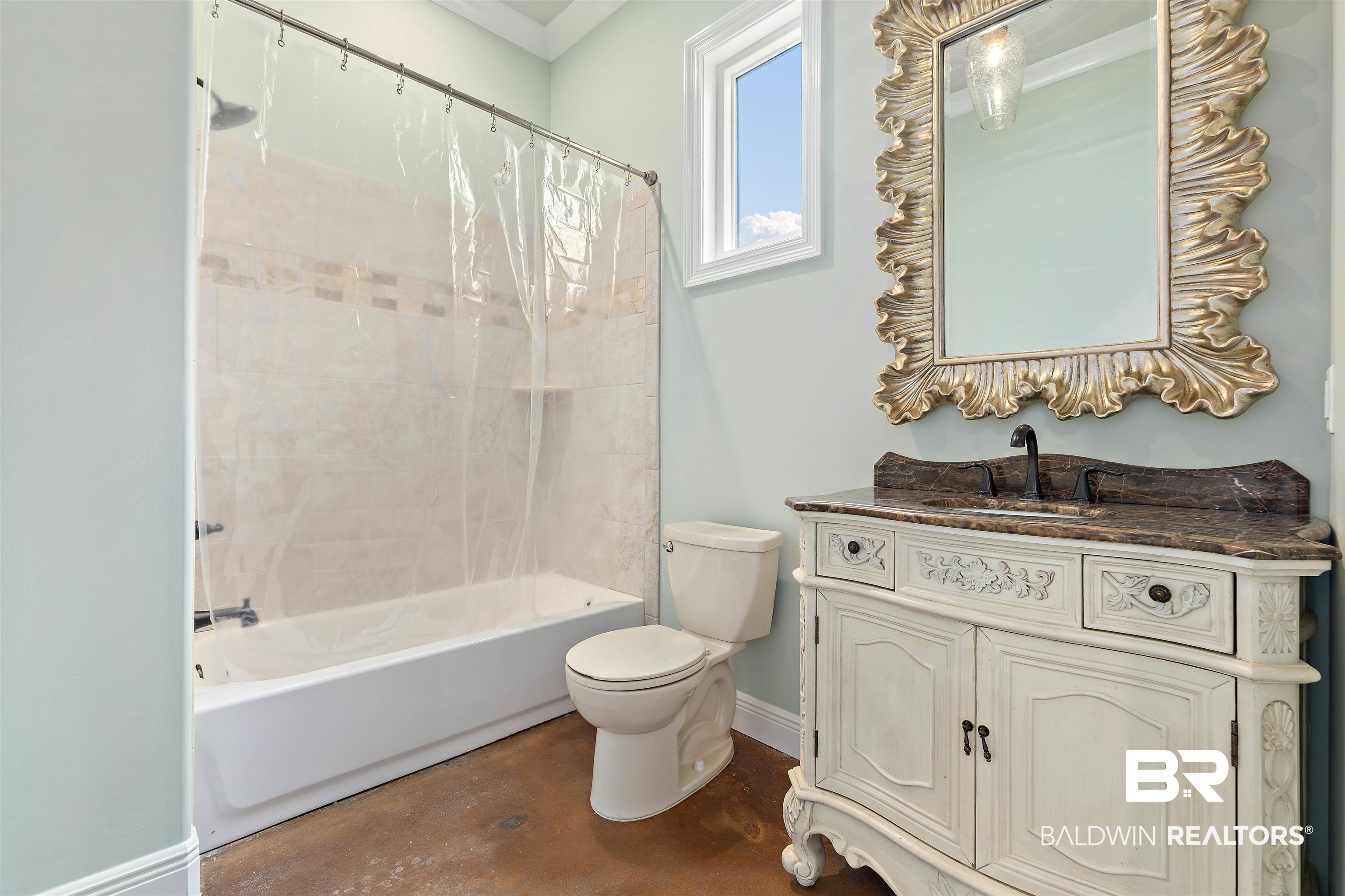 3584 Rue Royal Mobile, AL 36693 - Photo 27 of 35 Full bath featuring vanity, baseboards, shower / bath combo, concrete flooring, and toilet