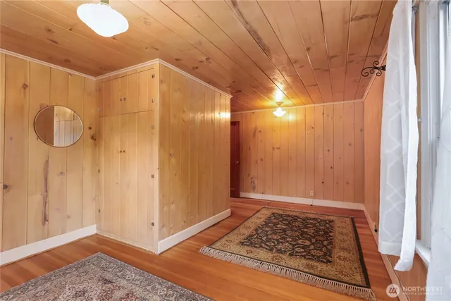 a view of a bedroom with table and chair