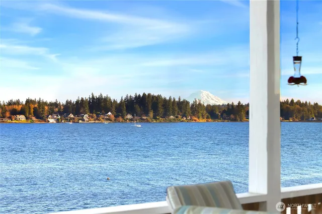 a view of balcony with furniture and wooden deck