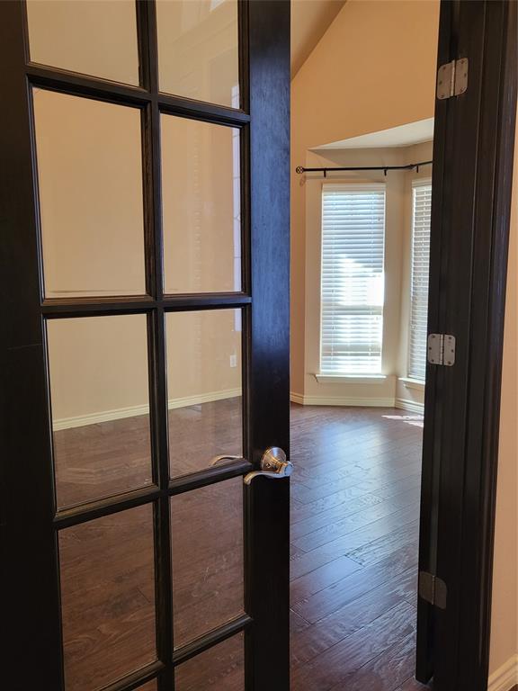 333 Cave River Drive Murphy, TX 75094 - Photo 12 of 26 view of wooden floor and windows in a room