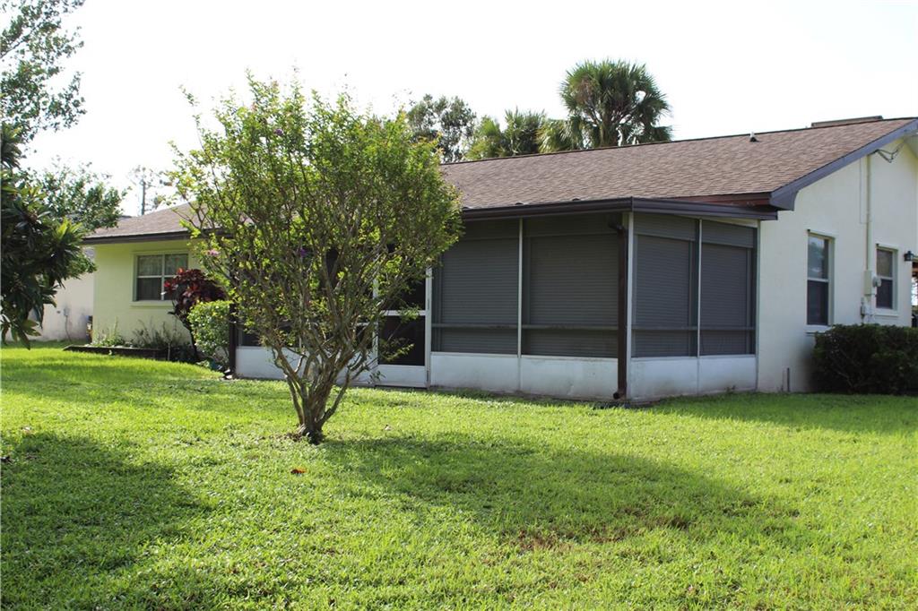 2105 Southeast Dolphin Road Port St. Lucie, FL 34952 - Photo 4 of 23 a view of front of a house with a yard