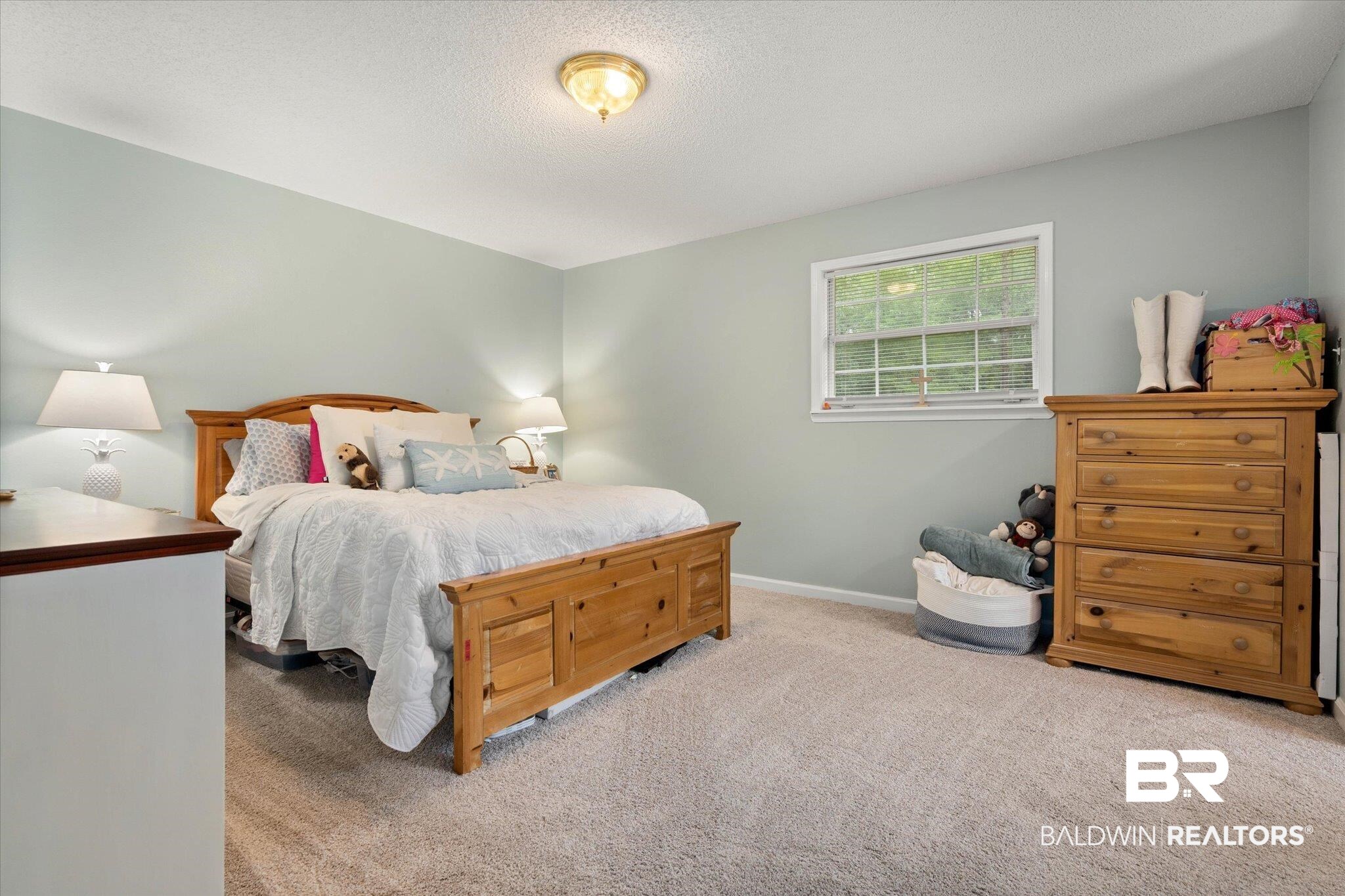 2300 Radcliff Road Saraland, AL 36571 - Photo 27 of 56 Carpeted bedroom with baseboards and a textured ceiling