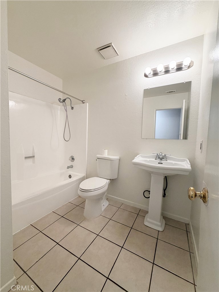 9668 Hemlock Street Rancho Cucamonga, CA 91730 - Photo 12 of 23 a bathroom with a sink toilet and shower