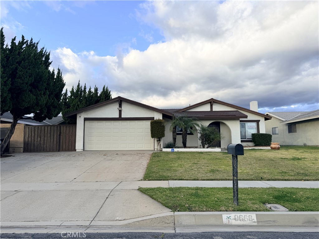 9668 Hemlock Street Rancho Cucamonga, CA 91730 - Photo 23 of 23 a front view of a house with garden