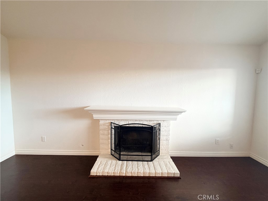 9668 Hemlock Street Rancho Cucamonga, CA 91730 - Photo 4 of 23 an empty room with a fireplace