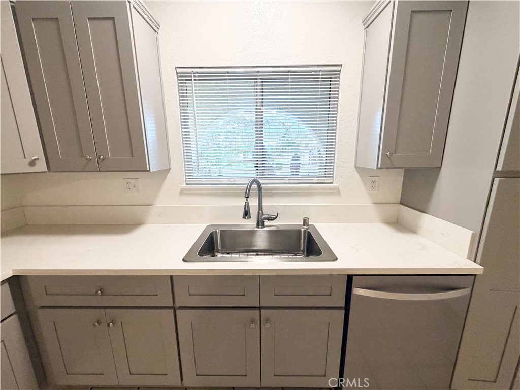 9668 Hemlock Street Rancho Cucamonga, CA 91730 - Photo 8 of 23 a kitchen with a sink and cabinets