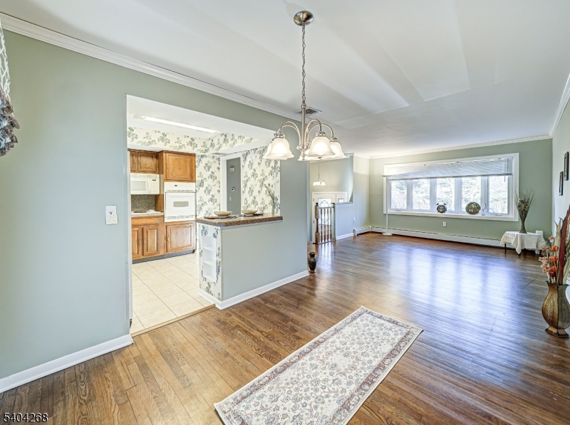 15 Patton Street High Bridge, NJ 08829 - Photo 13 of 46 a view of a living room and kitchen with a ceiling fan