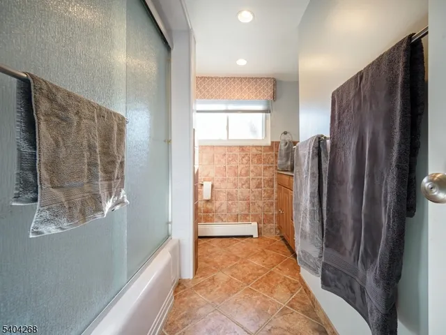 a view of a refrigerator in kitchen and wooden floor