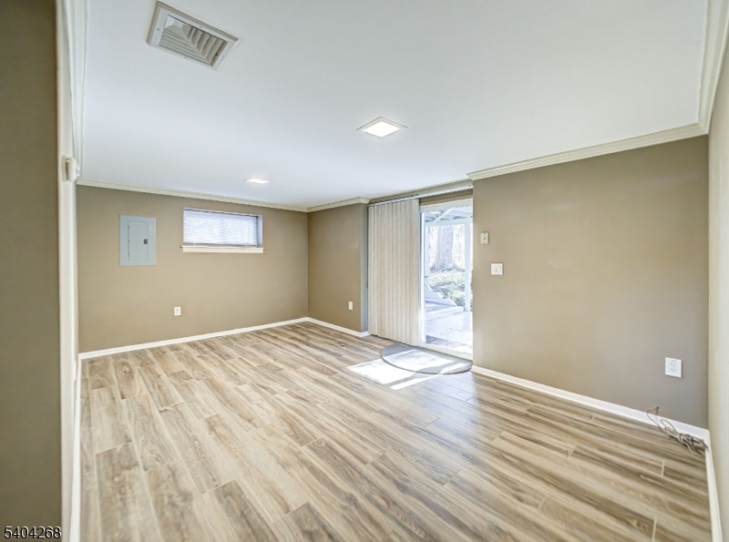 15 Patton Street High Bridge, NJ 08829 - Photo 27 of 46 a view of an empty room with wooden floor and a window