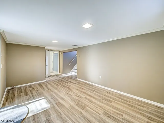 a view of room with wooden floor