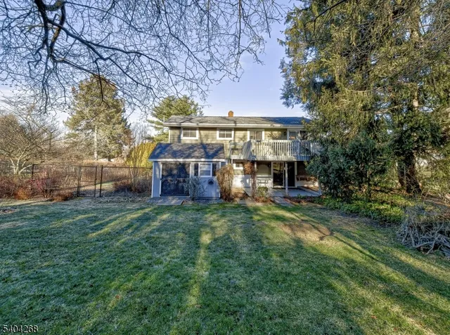 a view of house with a yard
