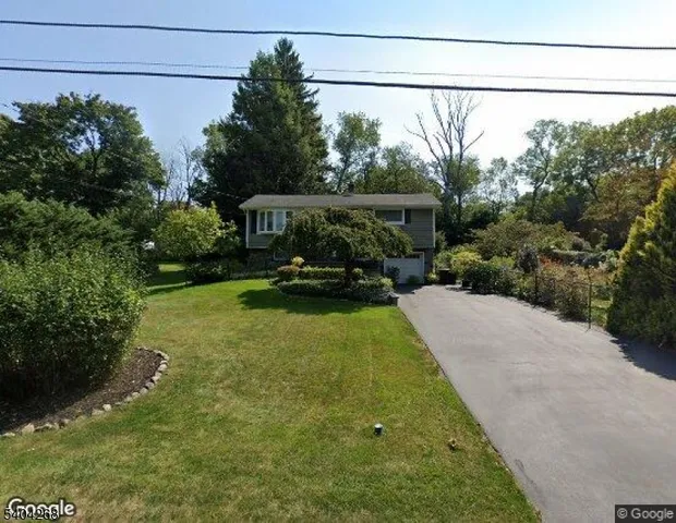 a view of a grassy field with trees