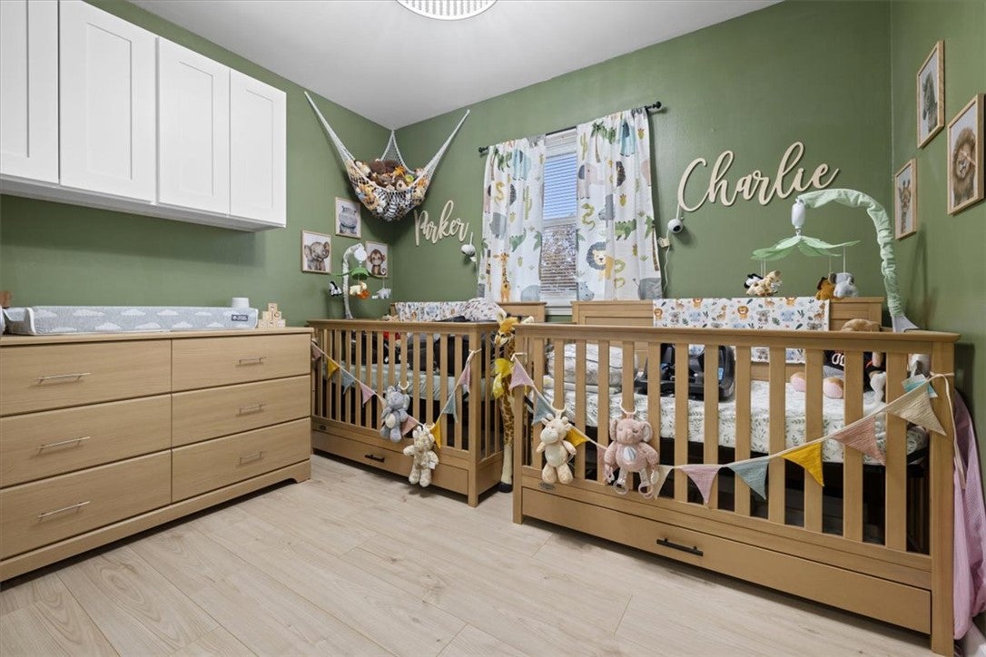 1482 Lee Road Troy, OH 45373 - Photo 11 of 30 This warm and bedroom could be an inviting nursery featuring ample natural light and abundant space for little ones.