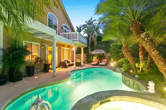 a view of a swimming pool with sitting area
