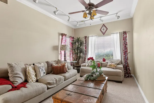 a living room with furniture and a large window