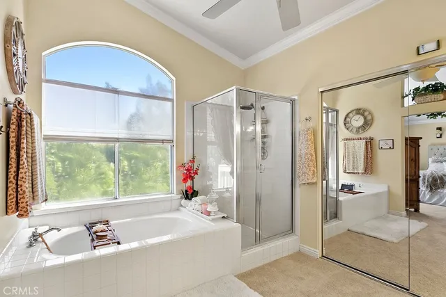 a bathroom with a tub shower and sink