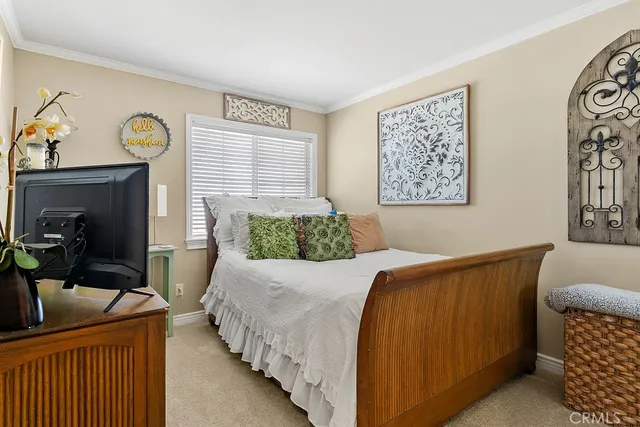 a bedroom with bed and furniture