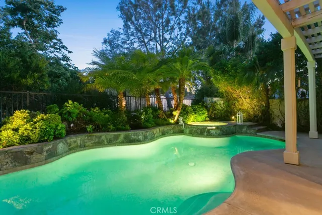 a view of a park with large trees