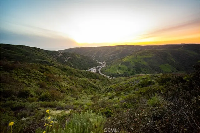 a view of a street with a building in the background