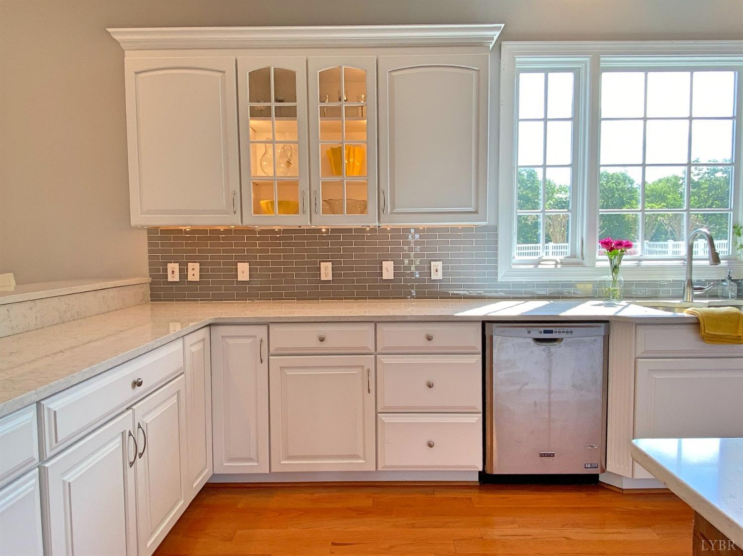 798 High Peak Road Monroe, VA 24574 - Photo 17 of 96 a kitchen with granite countertop a sink window and cabinets