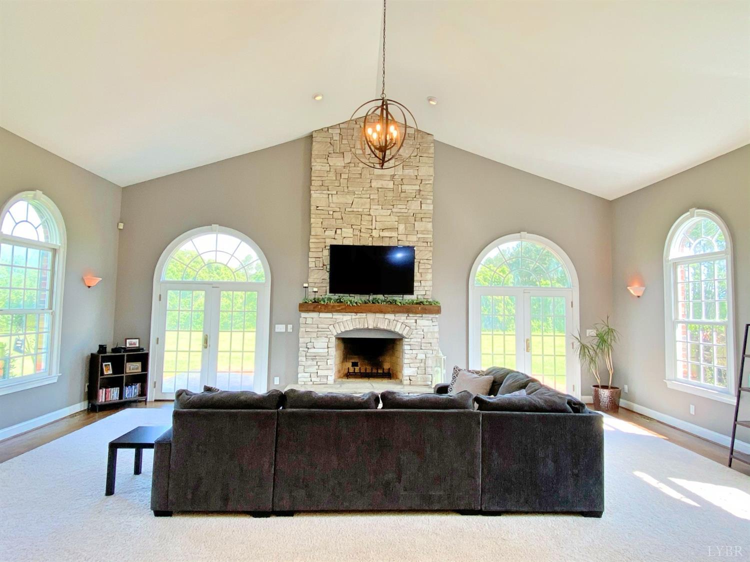 798 High Peak Road Monroe, VA 24574 - Photo 25 of 96 a living room with furniture a fireplace and a flat screen tv