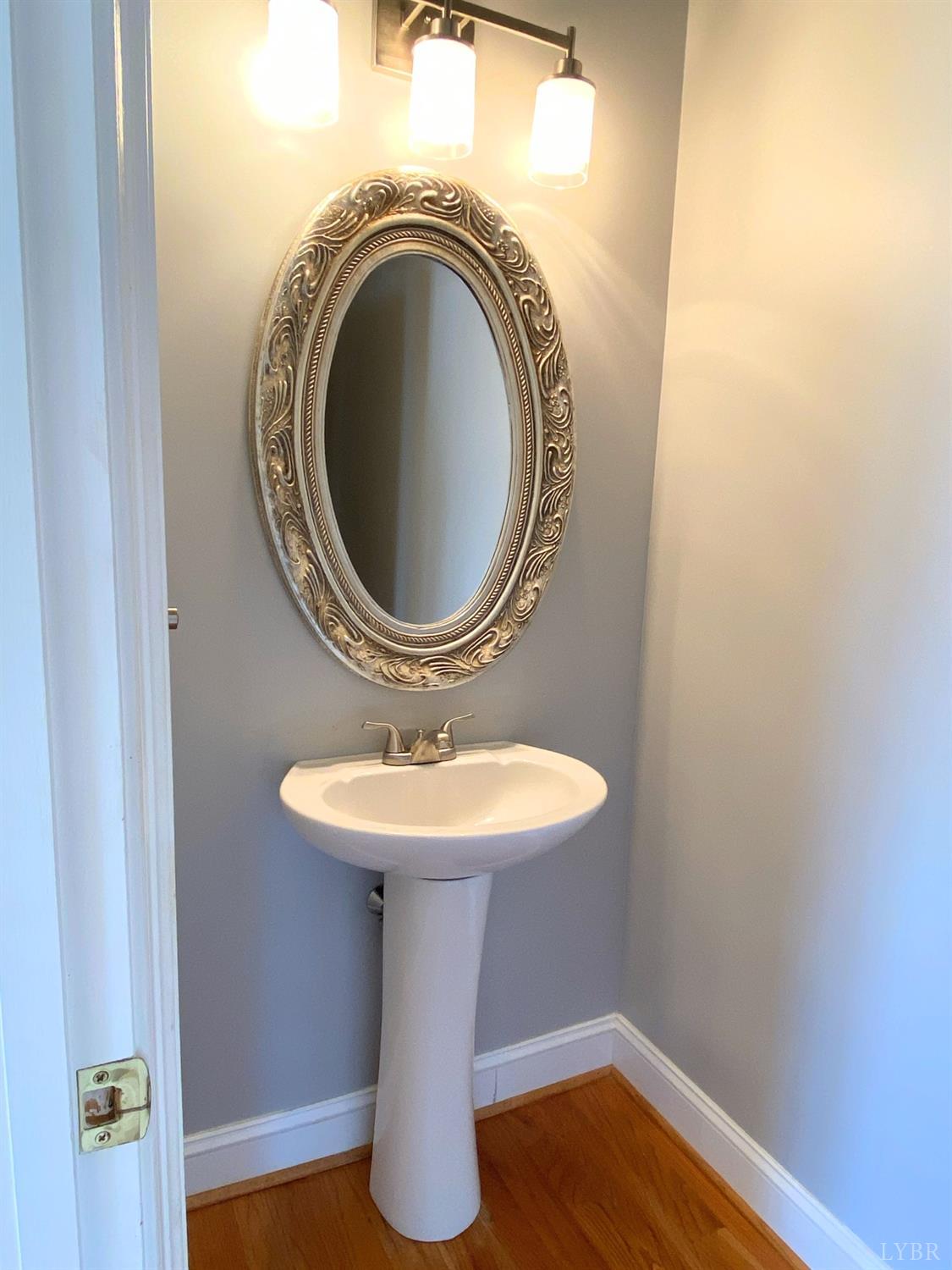 798 High Peak Road Monroe, VA 24574 - Photo 31 of 96 a bathroom with a sink and a mirror