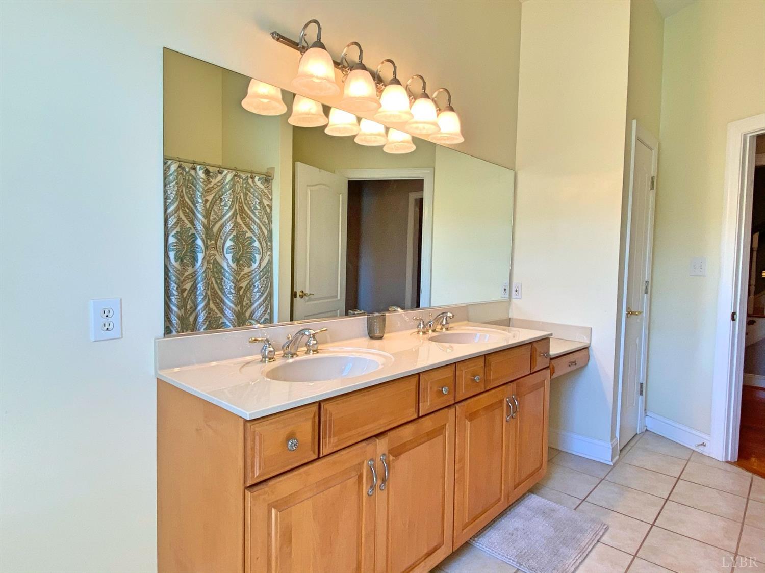 798 High Peak Road Monroe, VA 24574 - Photo 34 of 96 a bathroom with a sink vanity and a mirror