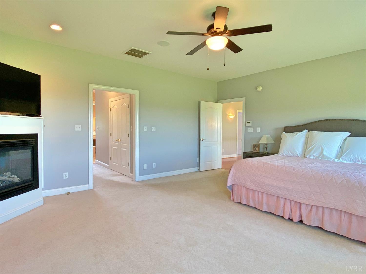 798 High Peak Road Monroe, VA 24574 - Photo 39 of 96 a bedroom with a bed and a ceiling fan
