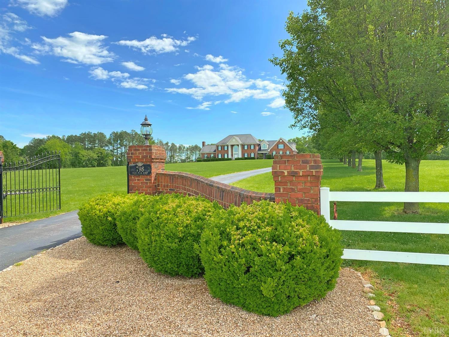 798 High Peak Road Monroe, VA 24574 - Photo 4 of 96 a view of a garden with a building in the background
