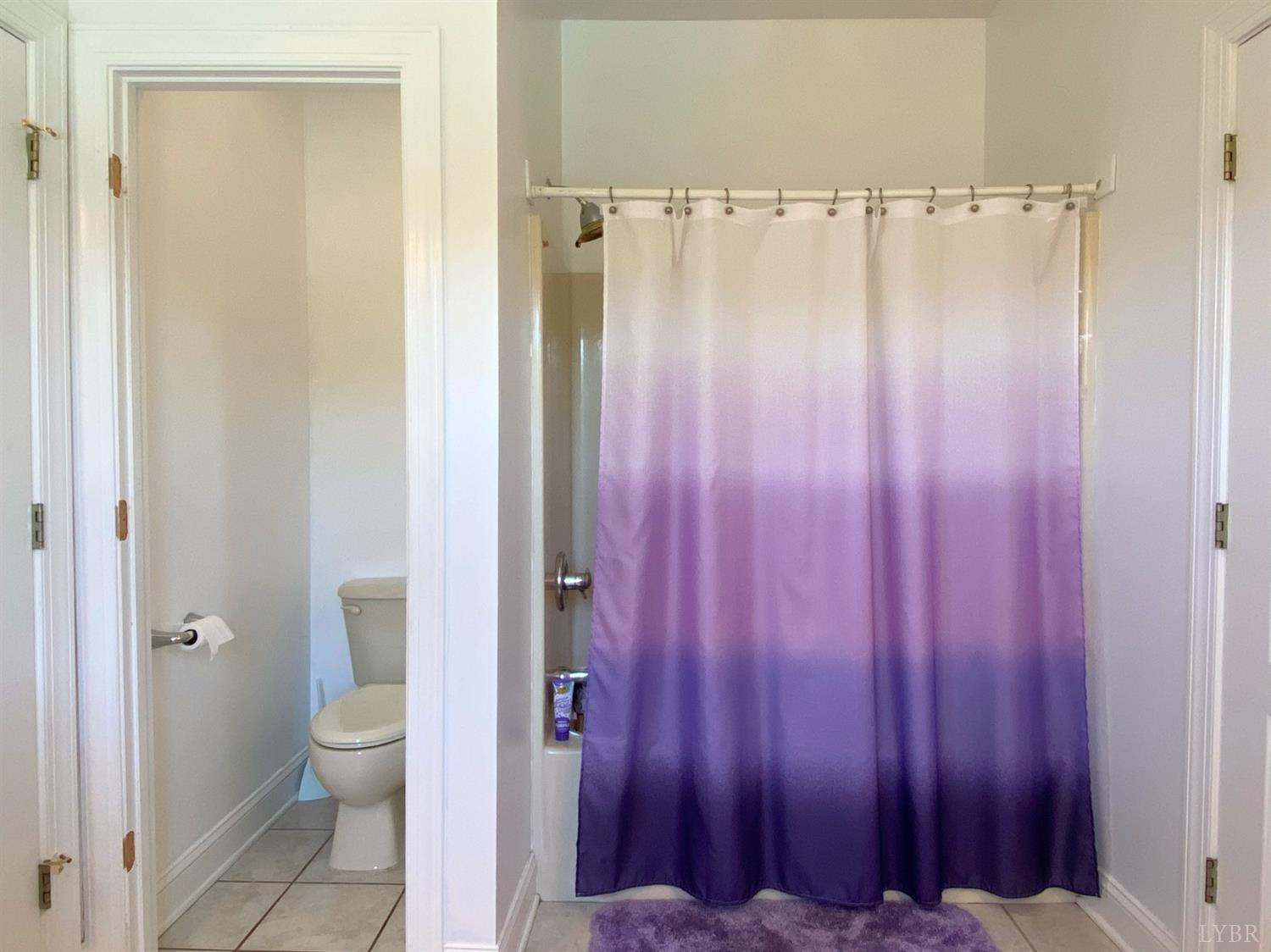 798 High Peak Road Monroe, VA 24574 - Photo 51 of 96 a view of a bathroom with a shower curtain