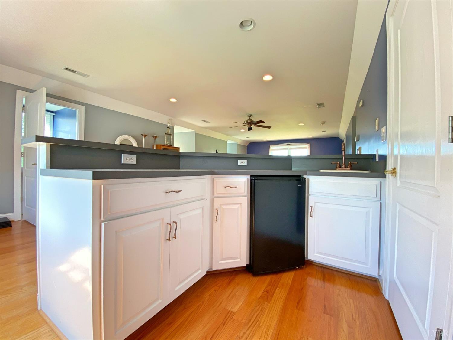 798 High Peak Road Monroe, VA 24574 - Photo 67 of 96 a kitchen with granite countertop a sink stainless steel appliances and cabinets