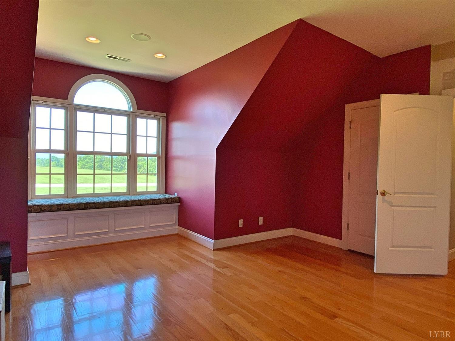798 High Peak Road Monroe, VA 24574 - Photo 72 of 96 a view of an empty room with wooden floor and a window