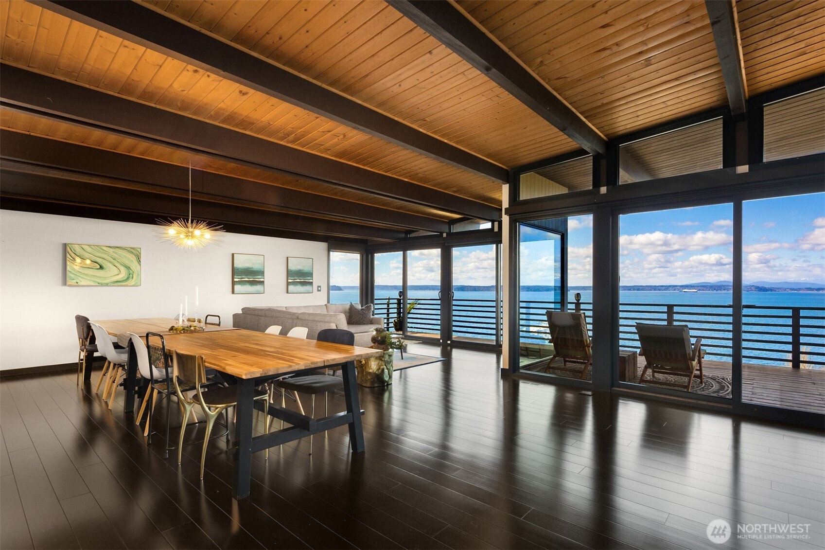 3831 58th Avenue Southwest Seattle, WA 98116 - Photo 15 of 40 a dining room with furniture window and wooden floor