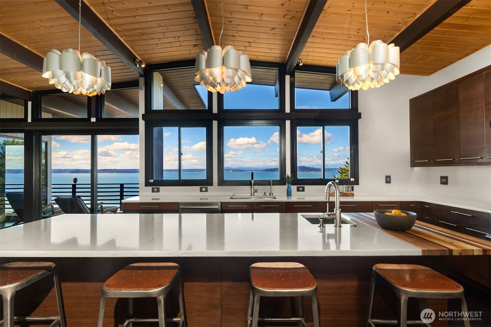 3831 58th Avenue Southwest Seattle, WA 98116 - Photo 7 of 40 a kitchen with a table chairs and a chandelier