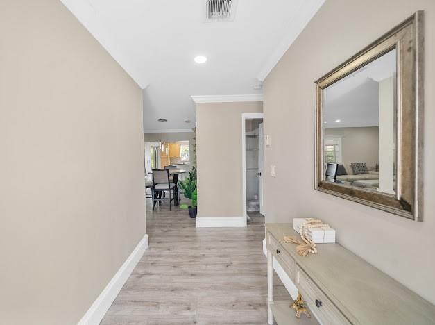 19426 Colorado Circle Boca Raton, FL 33434 - Photo 17 of 32 a hallway with wooden floor and cabinet