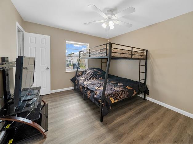19426 Colorado Circle Boca Raton, FL 33434 - Photo 18 of 32 a bedroom with a bed and a flat tv screen on the dresser