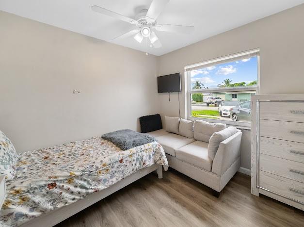 19426 Colorado Circle Boca Raton, FL 33434 - Photo 20 of 32 a bedroom with a bed couch and window