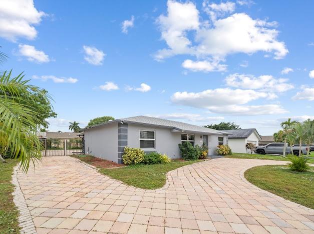 19426 Colorado Circle Boca Raton, FL 33434 - Photo 29 of 32 a view of house with outdoor space and sitting space