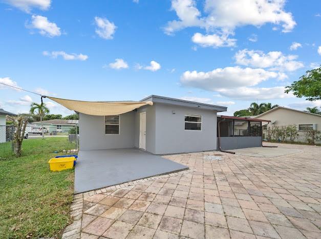 19426 Colorado Circle Boca Raton, FL 33434 - Photo 32 of 32 a view of a house with a backyard and sitting area