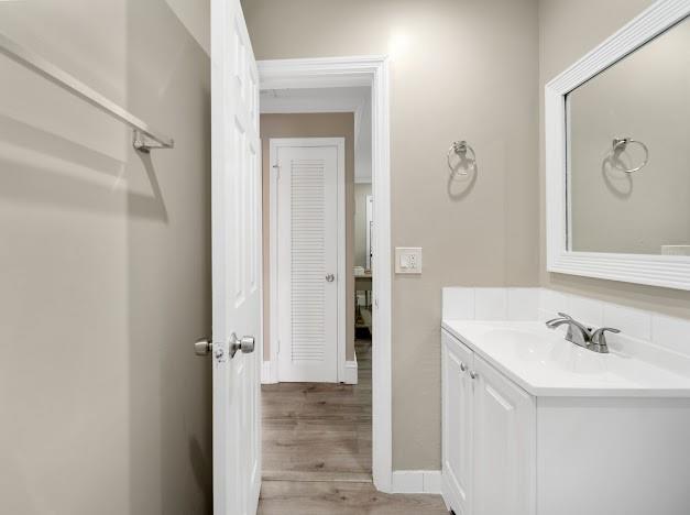 19426 Colorado Circle Boca Raton, FL 33434 - Photo 5 of 32 a bathroom with a sink and a mirror